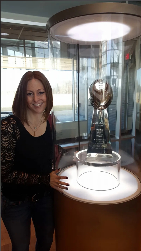 Lindsay B. Coleman with Superbowl trophy